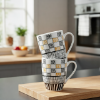 Picture of White Ceramic Mug Approx 300ml Capacity 11cm Height and 8cm Diameter with Black and Yellow Geometric Pattern Design Comfortable Handle Suitable for Tea Coffee and Hot Beverages for Daily Use in Home Office and Cafe Settings
